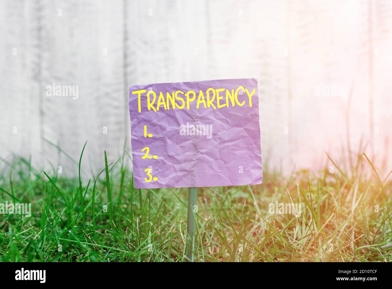 Conceptual hand writing showing Transparency. Concept meaning something transparent especially a picture viewed by light Plain paper attached to stick Stock Photo