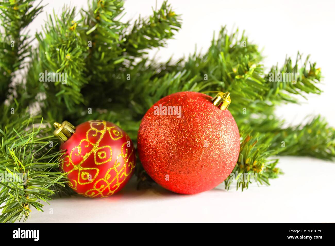 Red Christmas balls with branches of a Christmas tree. Xmas glass ball