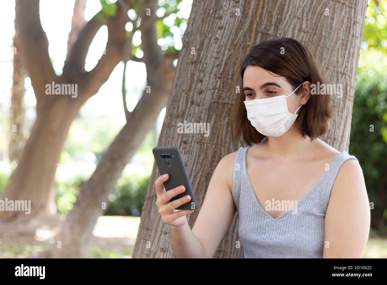 Woman wearing facemasks hi-res stock photography and images - Alamy