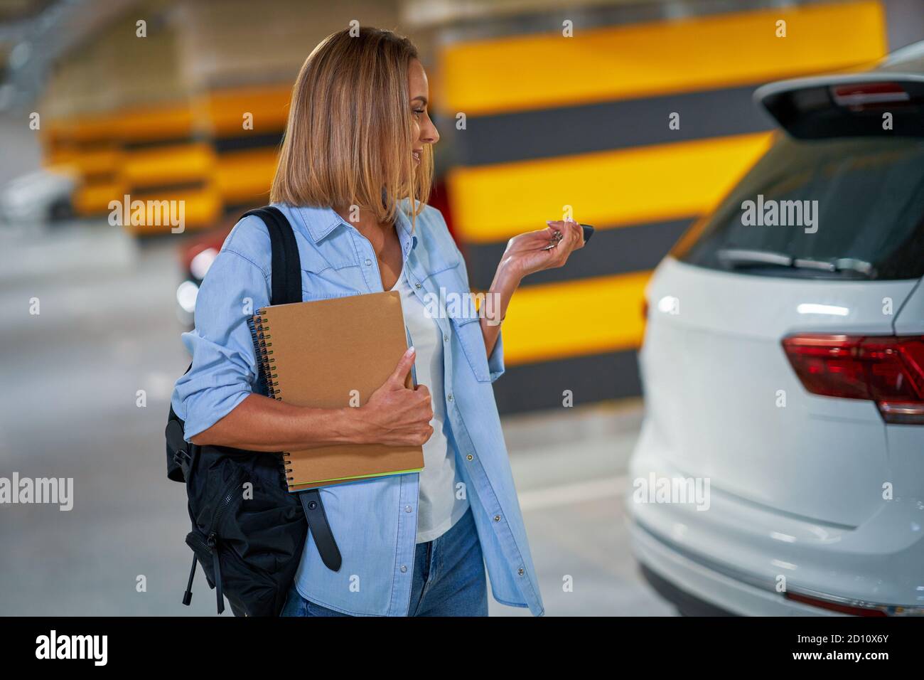 Student leaving car in underground parking lot Stock Photo Alamy