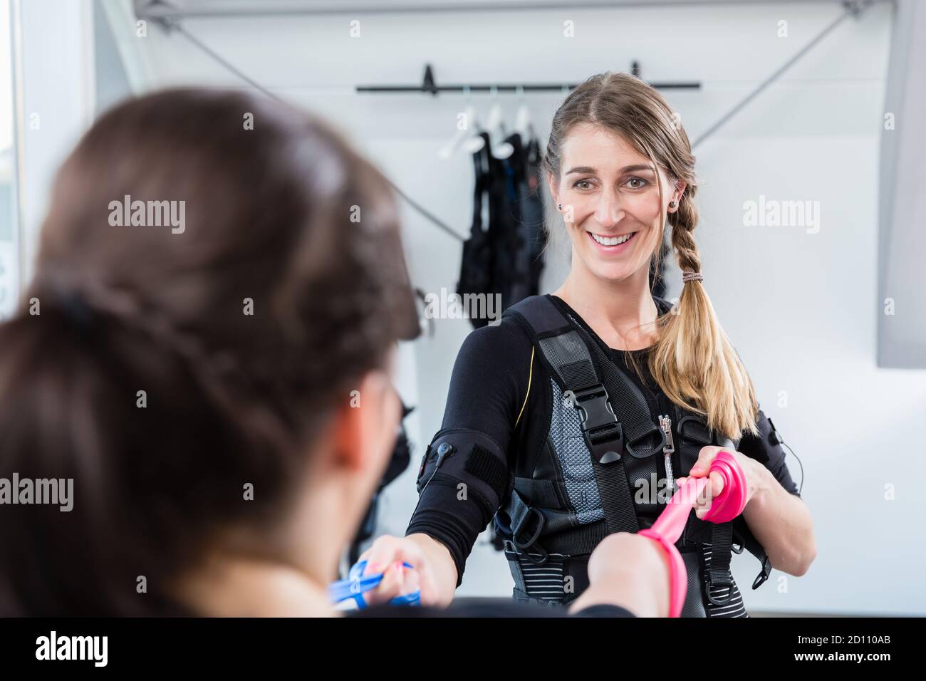 Skinny and plump woman having ems training together Stock Photo