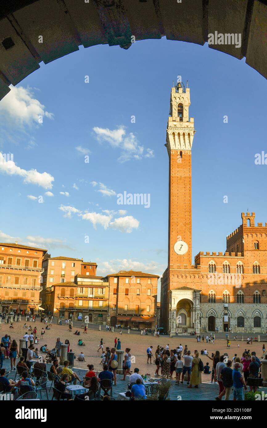 Piazza del Campo, main square of Siena, where the famous Palio takes place, with Palazzo Pubblico town hall and Torre del Mangia tower, Tuscany, Italy Stock Photo