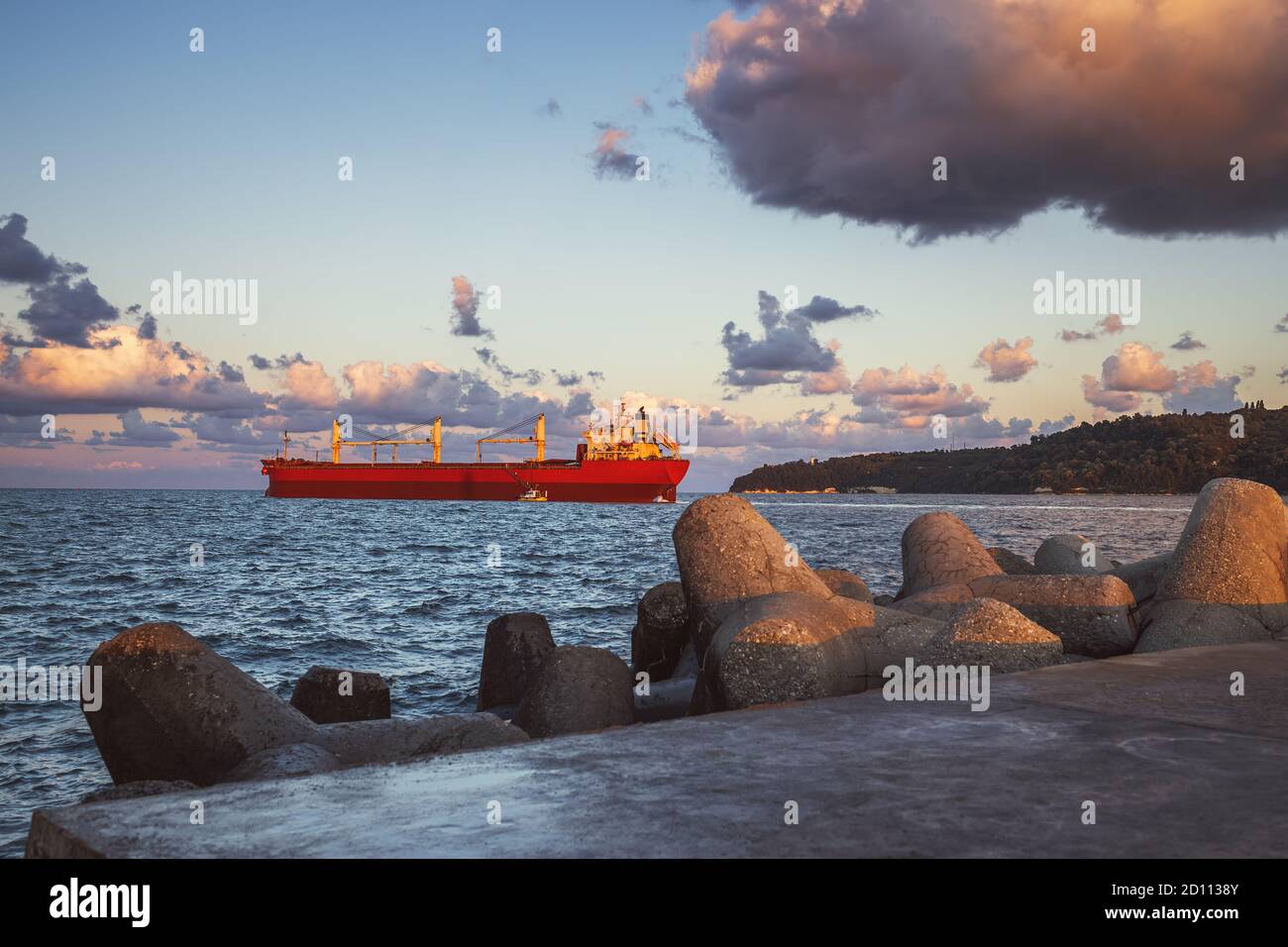 Cargo ship with containers on the harbour. Sea port Varna, Bulgaria. Stock Photo