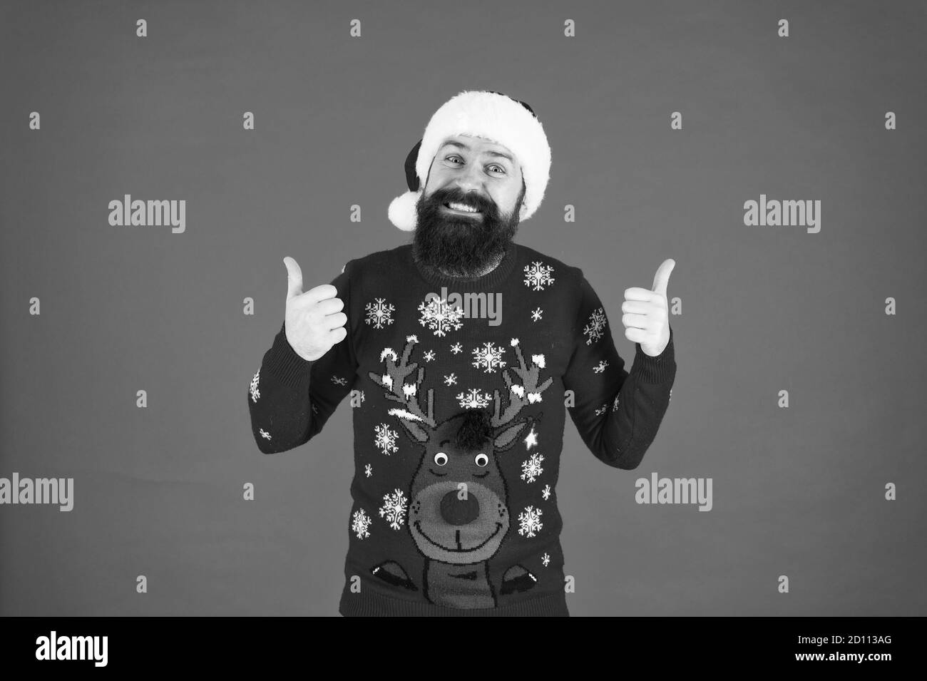 Hipster bearded man wear winter clothes red background. Start this party. Christmas celebration ideas. Happy new year celebration. Join holiday celebration. Winter party outfit. Sweater with deer. Stock Photo