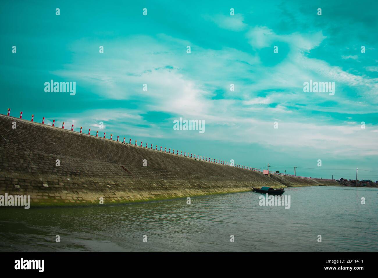 kishoreganj, Bangladesh sky, road, river, boat in one background Stock Photo