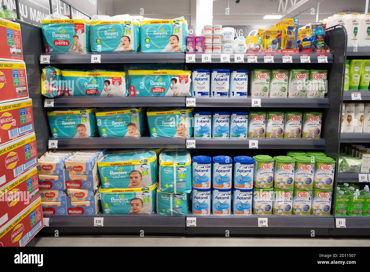 Baby products including nappies and baby food and formula milk on sale in a supermarket in Cardiff, Wales, United Kingdom. Stock Photo