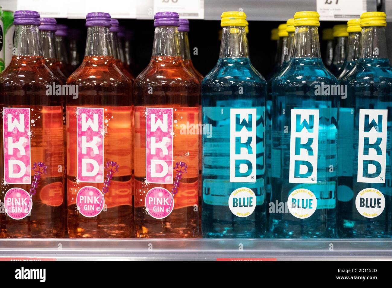 Bottles of red and blue WKD alcohol on sale in a supermarket in Cardiff, Wales, United Kingdom. Stock Photo