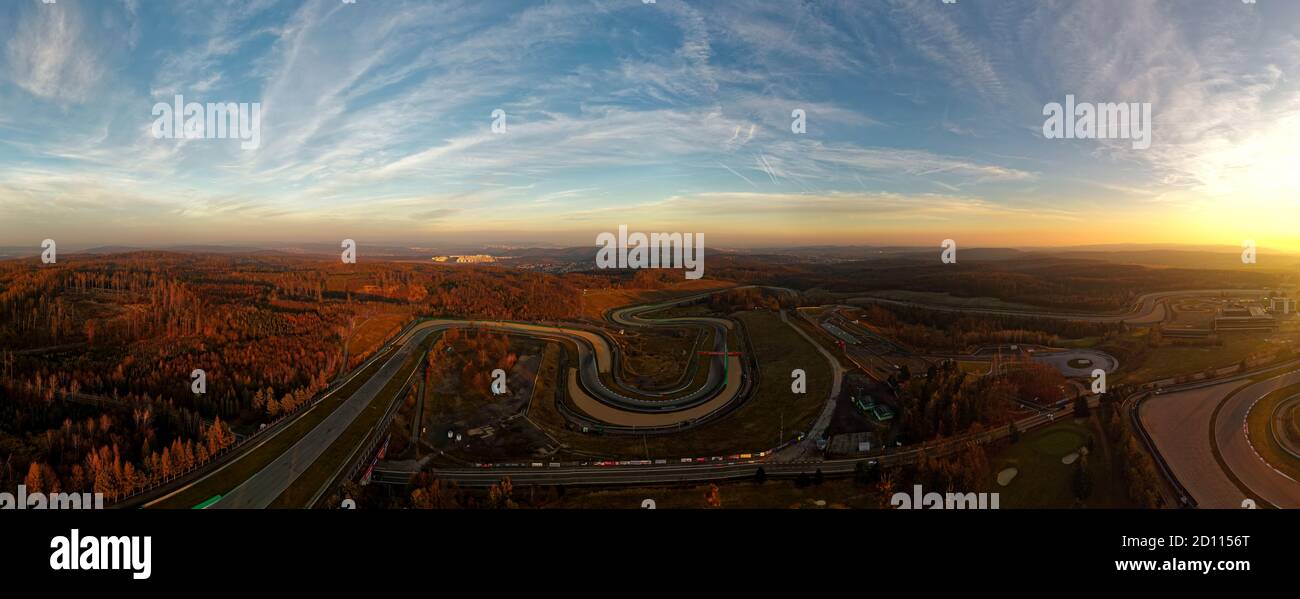 Landscape with the Automotodrom Racing circuit in Brno, Grand Prix of motorbikes and cars in the Czech republic. Panoramic view from the air during su Stock Photo