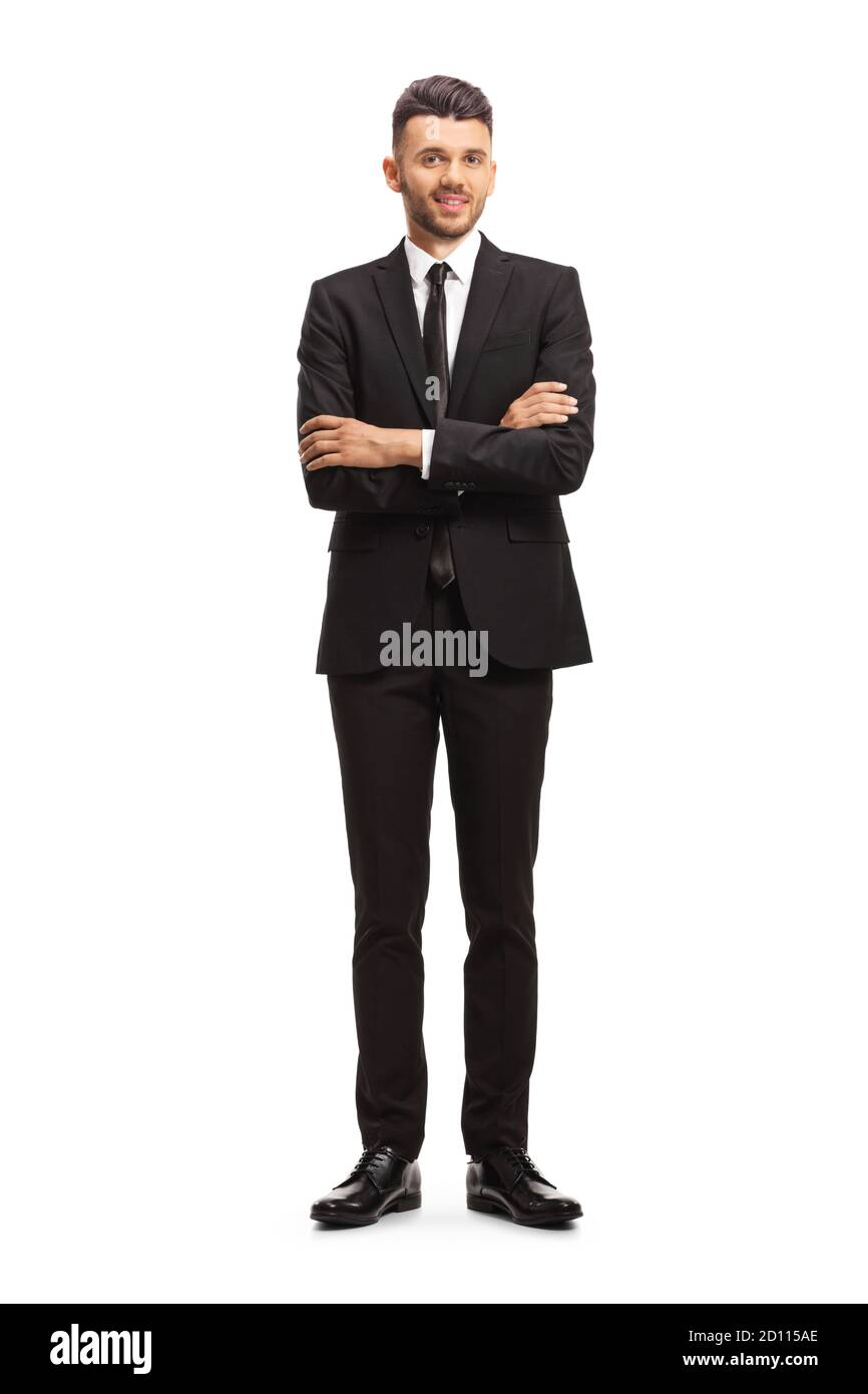 Full length portrait of a young businessman posing with crossed hands ...
