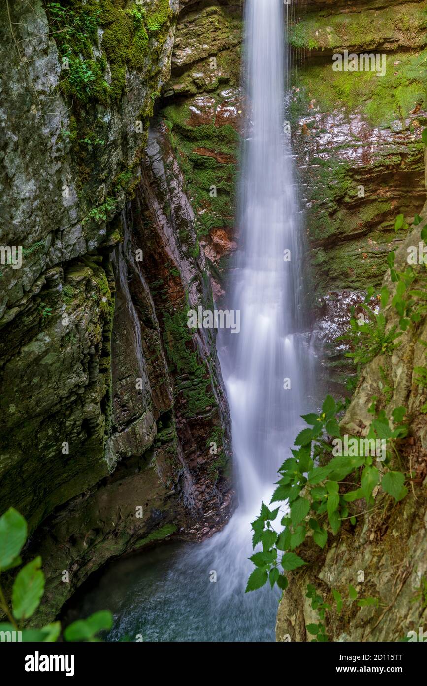 High waterfall in the mountain canyon. Amazing nature and landmarks of