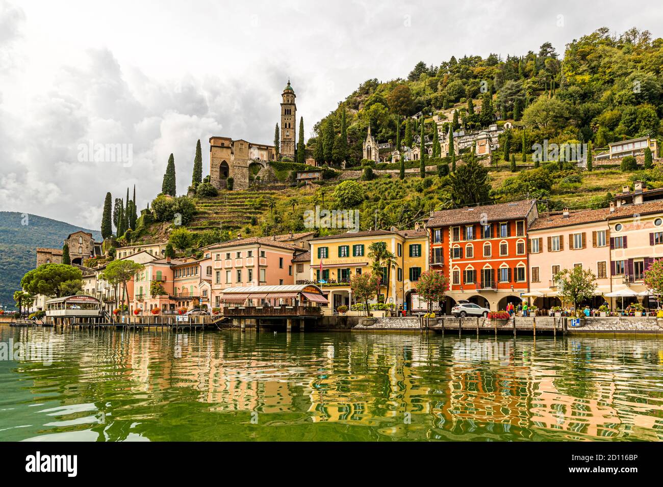 In Ticino, road cyclists like to ride the routes along the lake shores and through picturesque towns like Morcote on Lake Lugano. Circolo di Carona, Switzerland Stock Photo