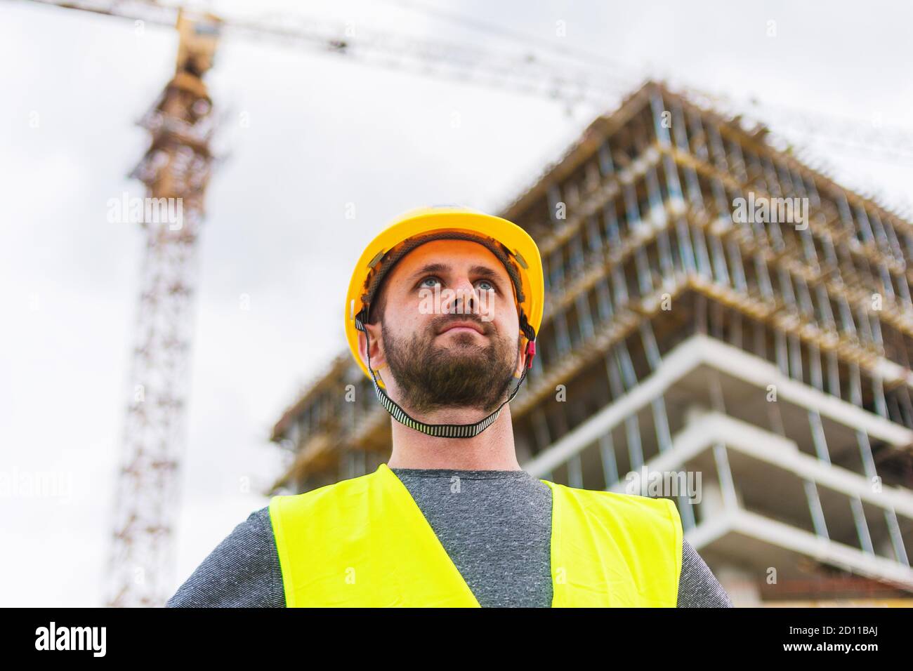 Engineer architecture employee worker on construction site looking on ...