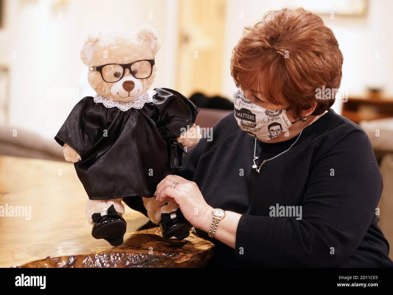 Clayton, United States. 04th Oct, 2020. Build-A-Bear Workshop founder Maxine Clark, adjusts the robe on her newest creation, the Ruth Bader Ginsbear, in Clayton, Missouri on Sunday, October 4, 2020. Clark says the stores are not selling the bear readymade, however Build-A-Bear has all the ingredients in their stores to create the bear. Photo by Bill Greenblatt/UPI Credit: UPI/Alamy Live News Stock Photo
