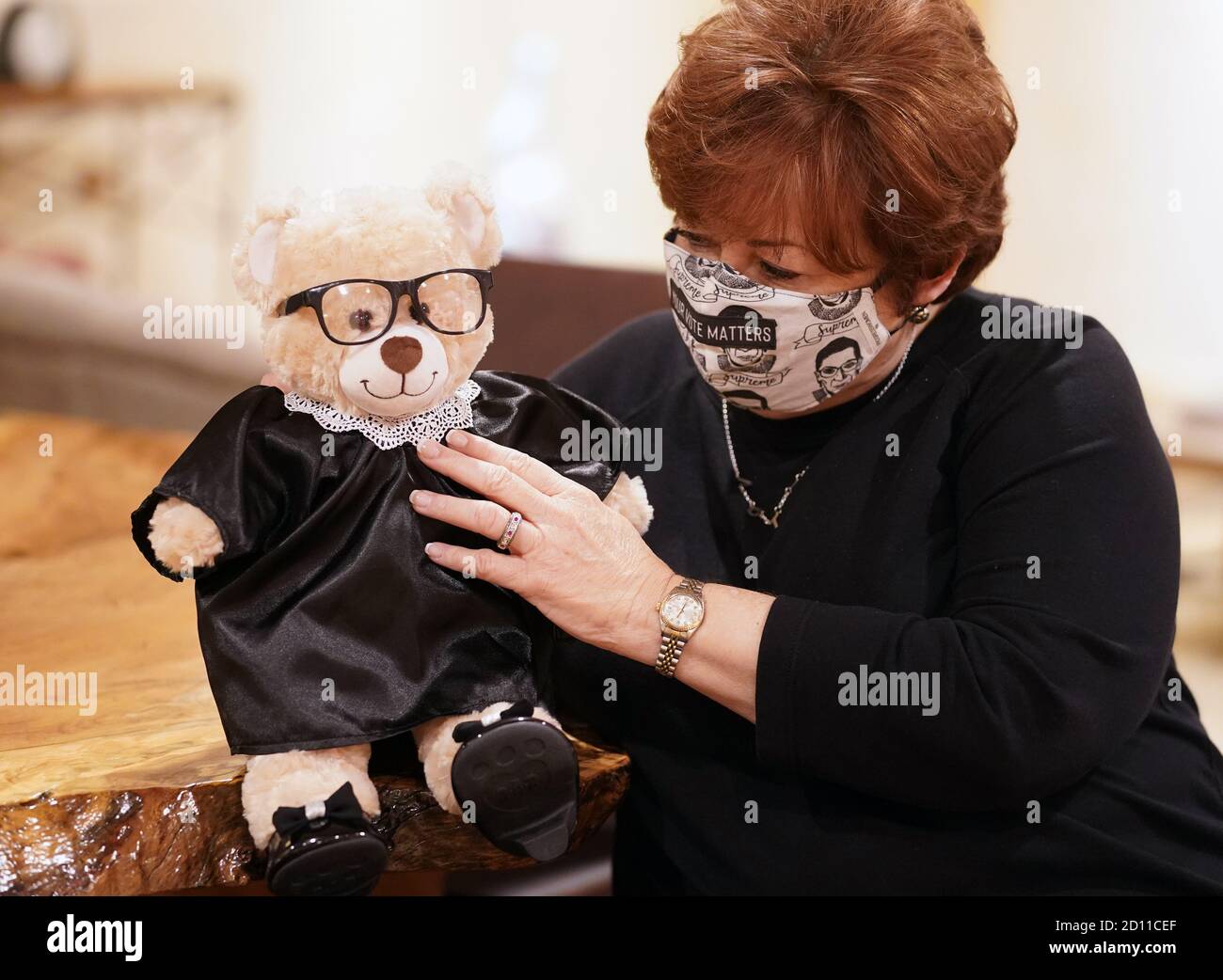 Clayton, United States. 04th Oct, 2020. Build-A-Bear Workshop founder Maxine Clark, adjusts the collar on her newest creation, the Ruth Bader Ginsbear, in Clayton, Missouri on Sunday, October 4, 2020. Clark says the stores are not selling the bear readymade, however Build-A-Bear has all the ingredients in their stores to create the bear. Photo by Bill Greenblatt/UPI Credit: UPI/Alamy Live News Stock Photo