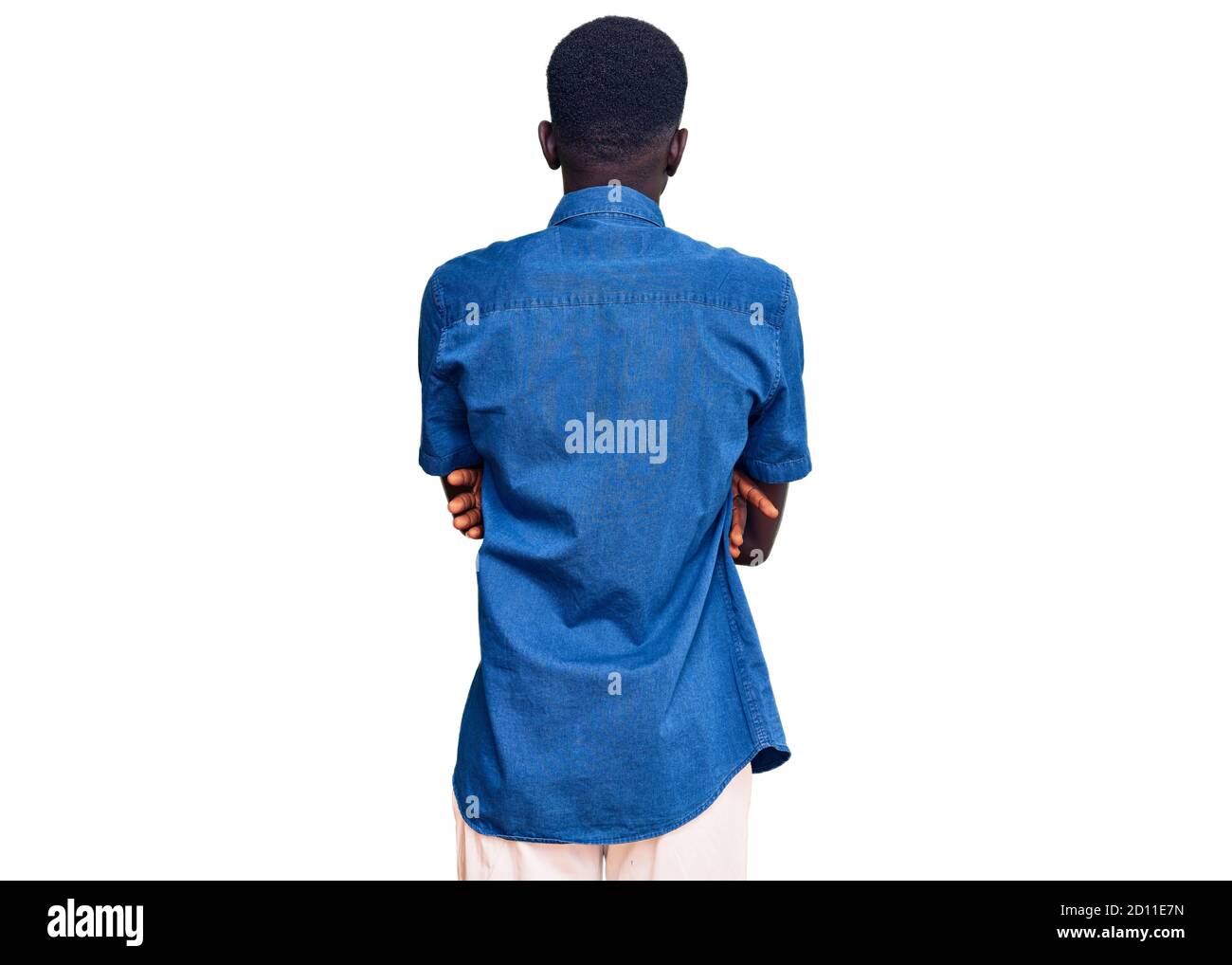 Young african american man wearing casual clothes standing backwards ...