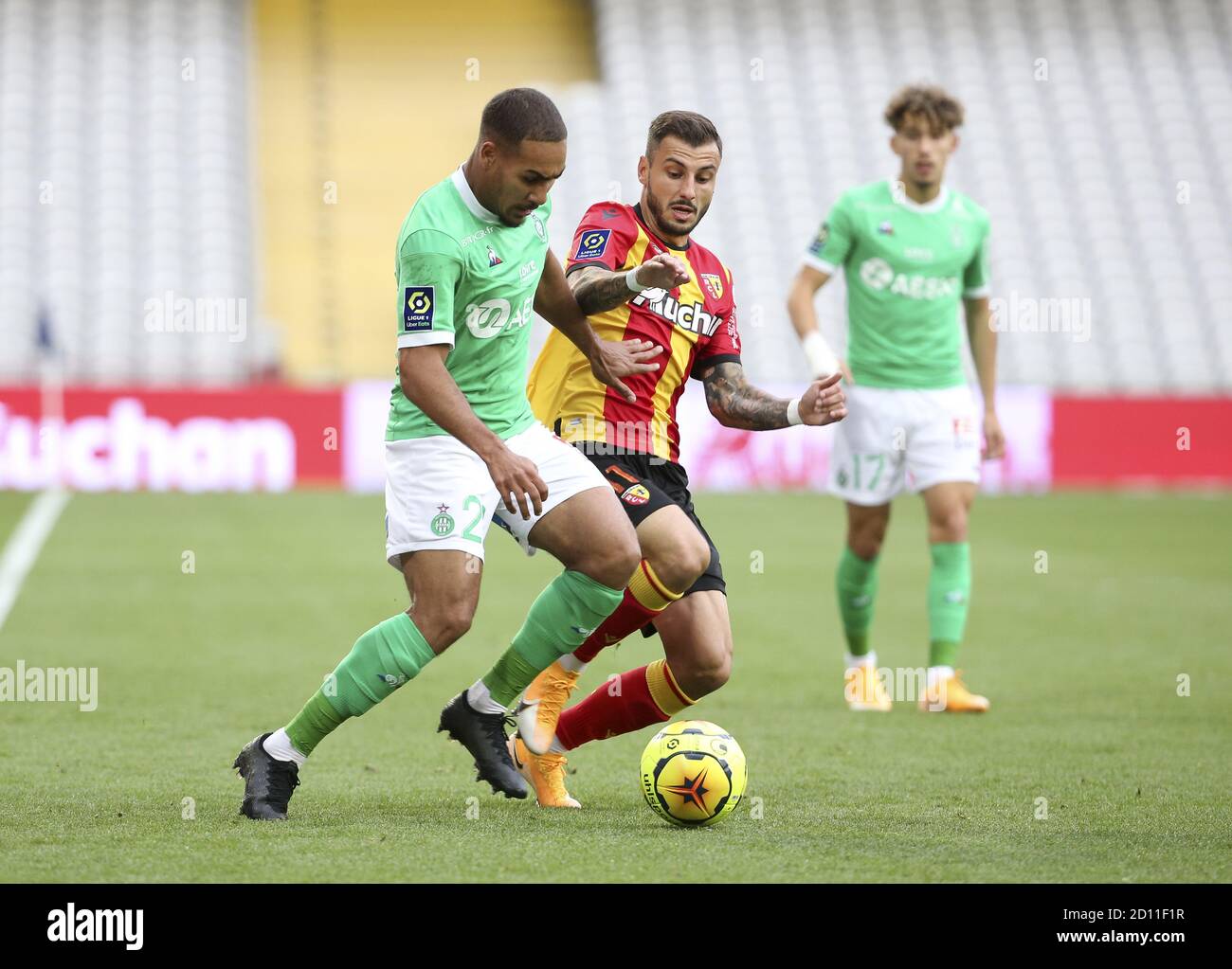 Ivann Macon of Saint-Etienne, Jonathan Clauss of Lens during the French championship Ligue 1 football match between RC Lens and AS Saint Etienne (ASSE Stock Photo