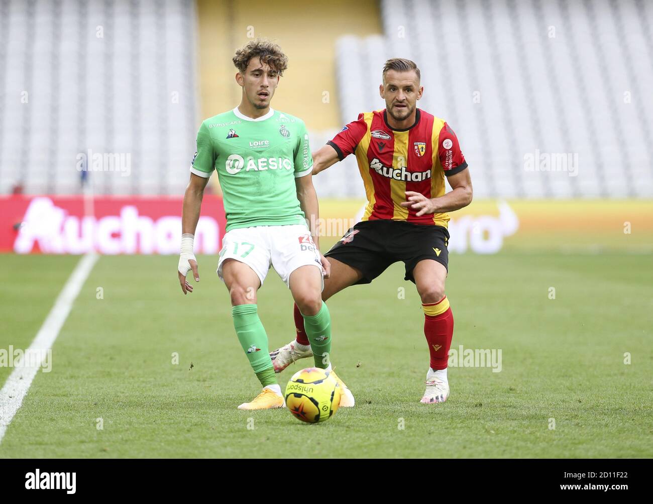 Adil Aouchiche of Saint-Etienne, Jonathan Gradit of Lens during the French championship Ligue 1 football match between RC Lens and AS Saint Etienne (A Stock Photo