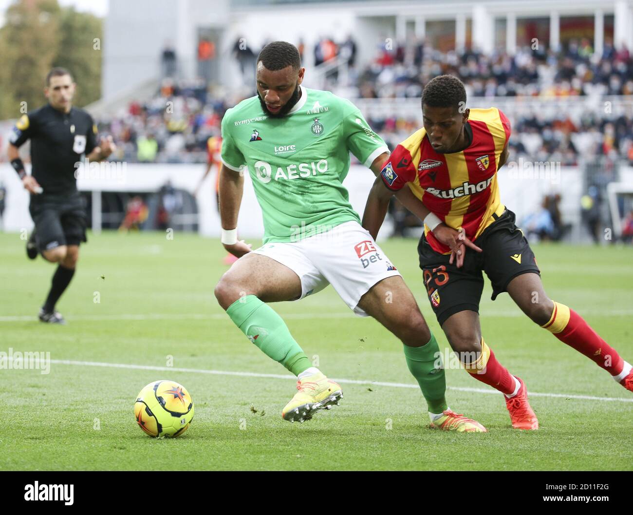 Harold Moukoudi of Saint-Etienne, Simon Banza of Lens during the French championship Ligue 1 football match between RC Lens and AS Saint Etienne (ASSE Stock Photo