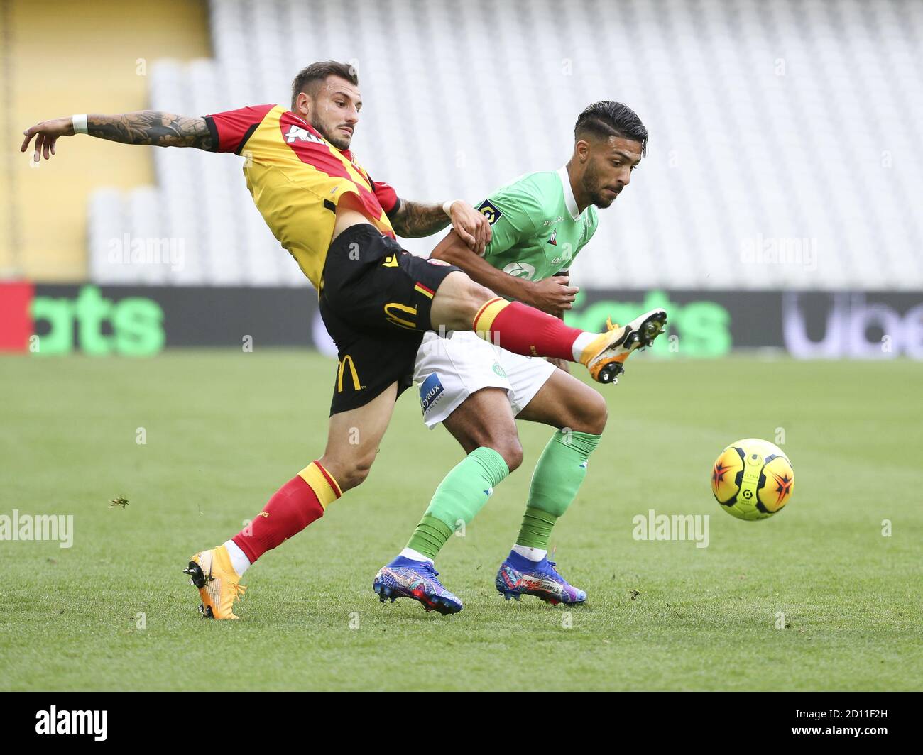 Jonathan Clauss of Lens, Denis Bouanga of Saint-Etienne during the French championship Ligue 1 football match between RC Lens and AS Saint Etienne (AS Stock Photo