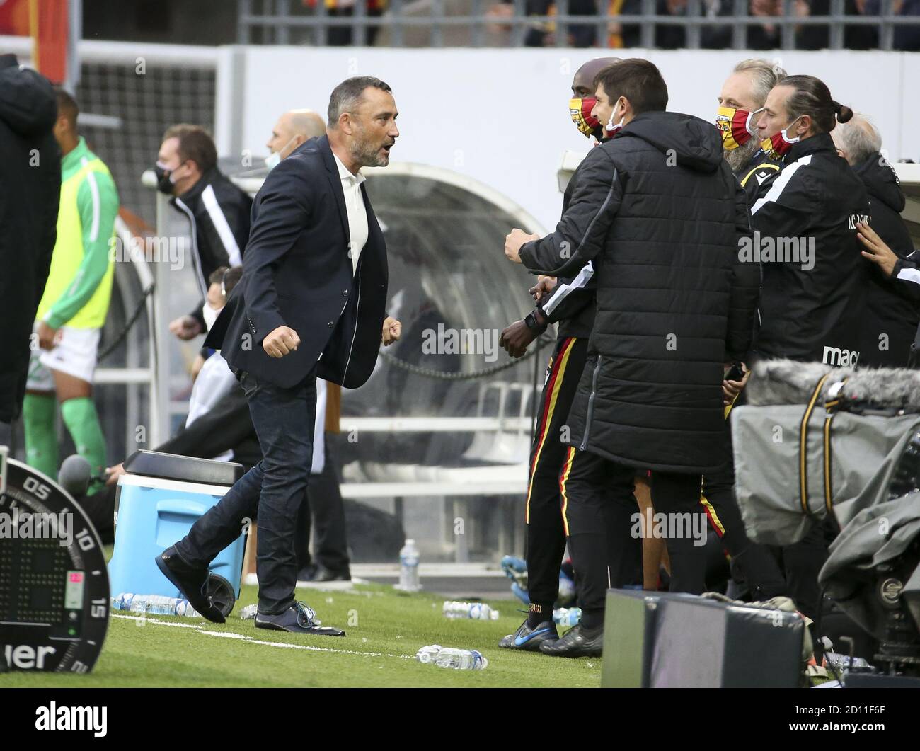 Coach of RC Lens Franck Haise celebrates the second goal of his team with his staff during the French championship Ligue 1 football match between RC L Stock Photo