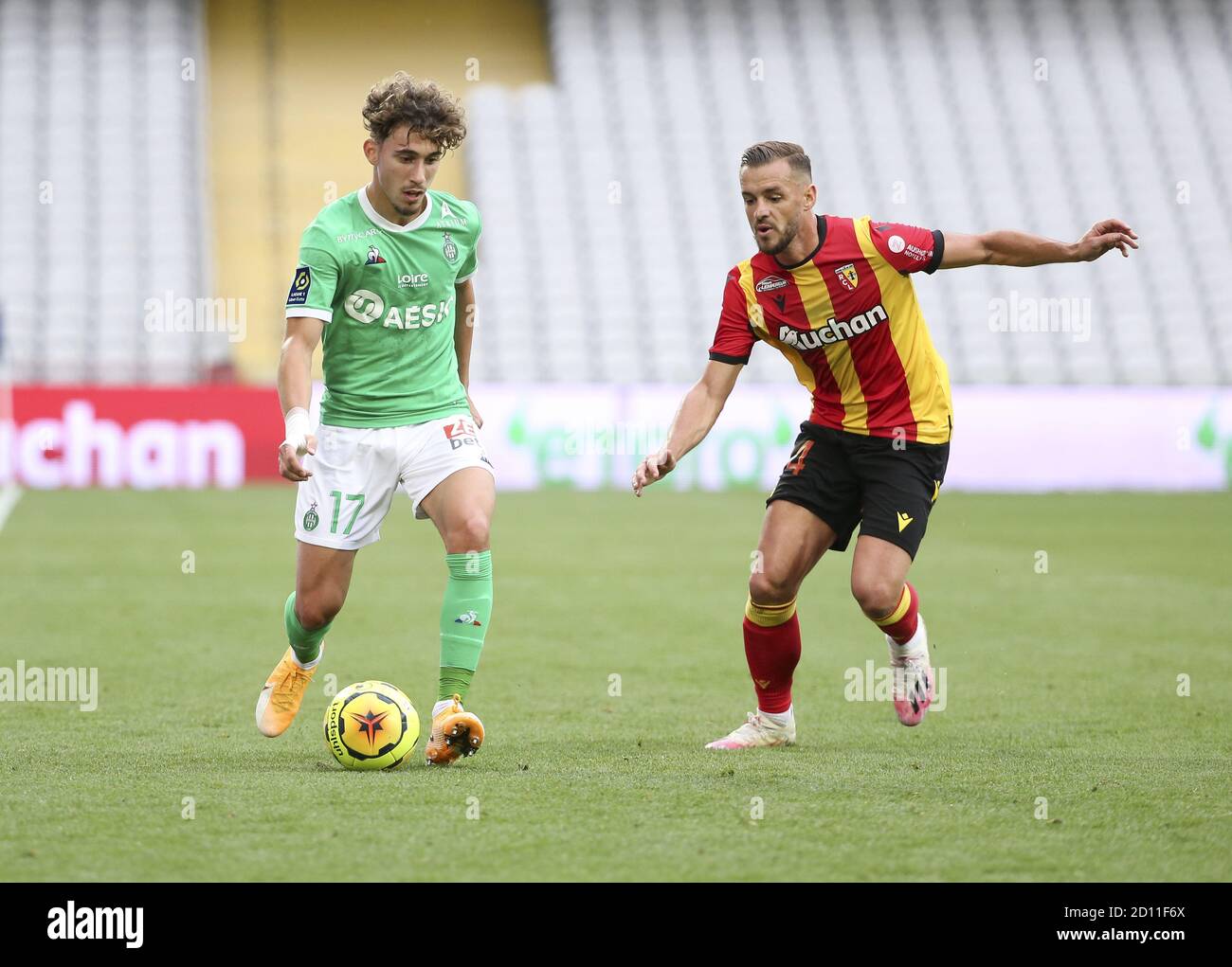 Adil Aouchiche of Saint-Etienne, Jonathan Gradit of Lens during the French championship Ligue 1 football match between RC Lens and AS Saint Etienne (A Stock Photo