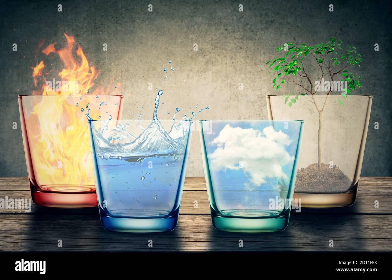 Four Elements of the nature in glasses isolated on studio gray background. Natural symbol concept. Stock Photo