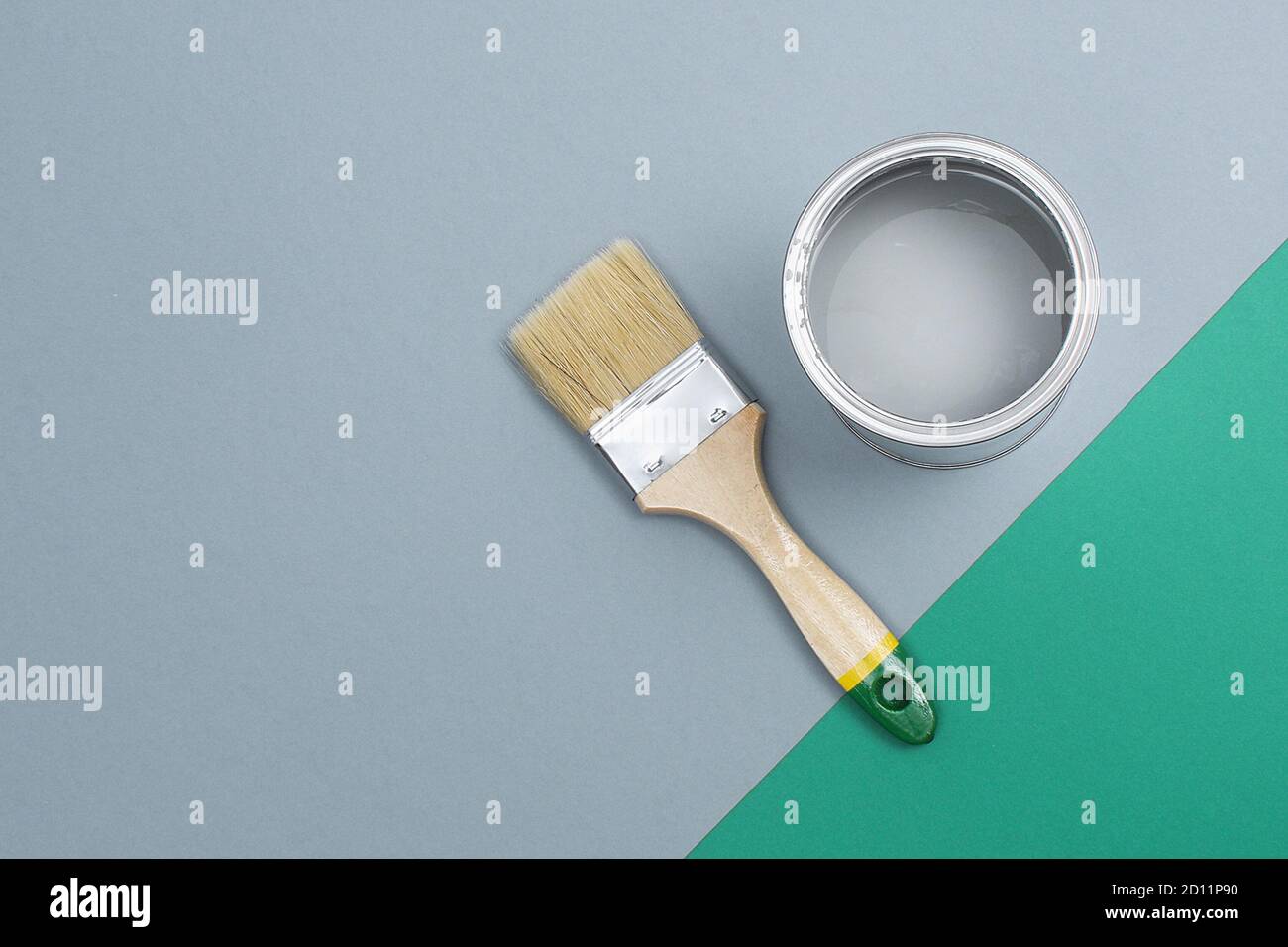 Open paint enamel cans on gray green palette samples. The concept of repair, construction Stock ...