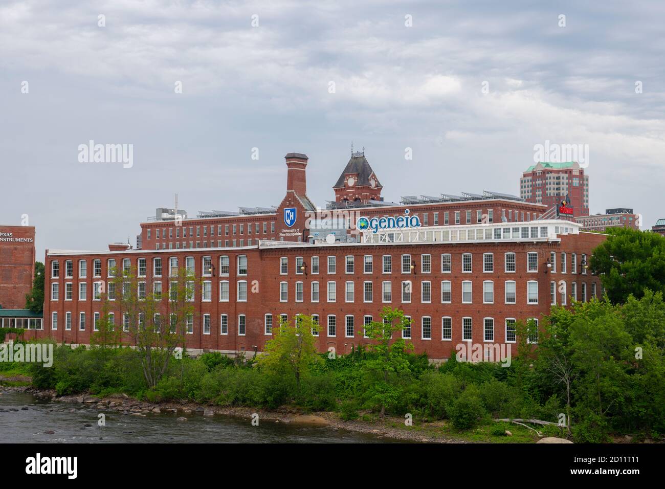 Historic Amoskeag Mill buildings at the bank of Merrimack River in