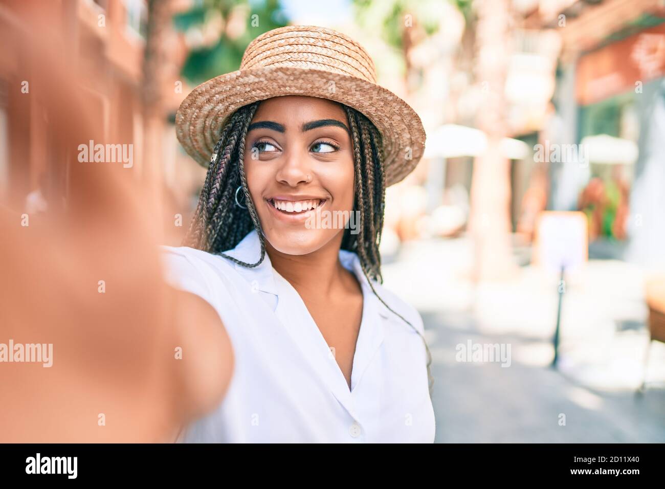 Young african american woman with braids smiling happy taking selfie ...