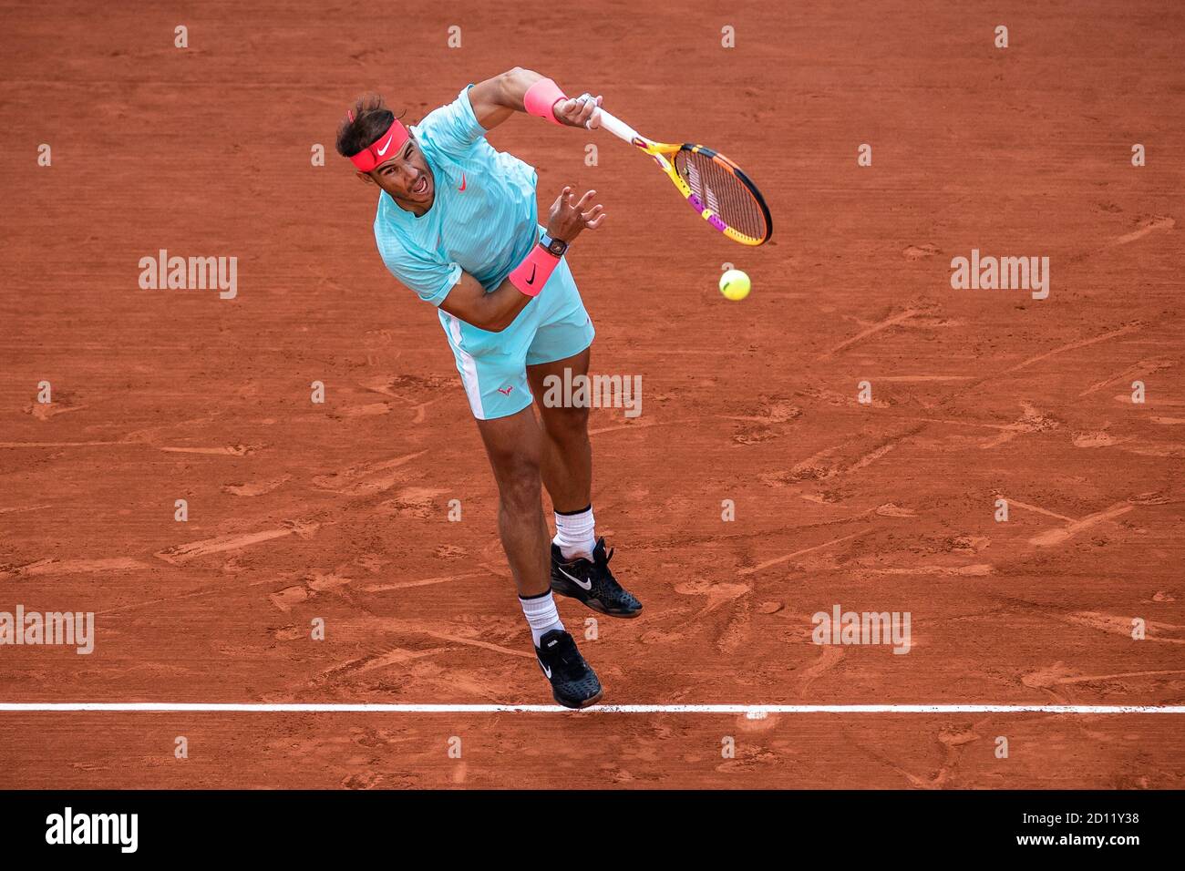 Paris, France. 4th Oct, 2020. Rafael Nadal serves during the men's singles 4th round match between Rafael Nadal of Spain and Sebastian Korda of the United States at the French Open tennis tournament 2020 at Roland Garros in Paris, France, Oct. 4, 2020. Credit: Aurelien Morissard/Xinhua/Alamy Live News Stock Photo