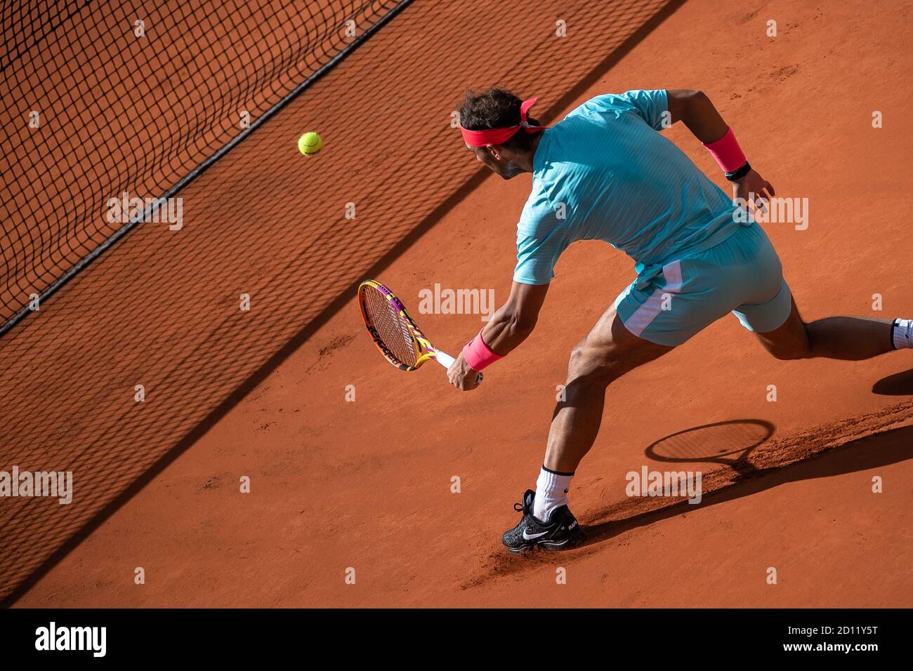 Paris, France. 4th Oct, 2020. Rafael Nadal hits a return during the men's singles 4th round match between Rafael Nadal of Spain and Sebastian Korda of the United States at the French Open tennis tournament 2020 at Roland Garros in Paris, France, Oct. 4, 2020. Credit: Aurelien Morissard/Xinhua/Alamy Live News Stock Photo