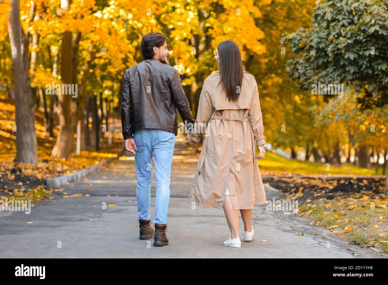 Lovers spending time together in autumn forest, walking by Stock Photo