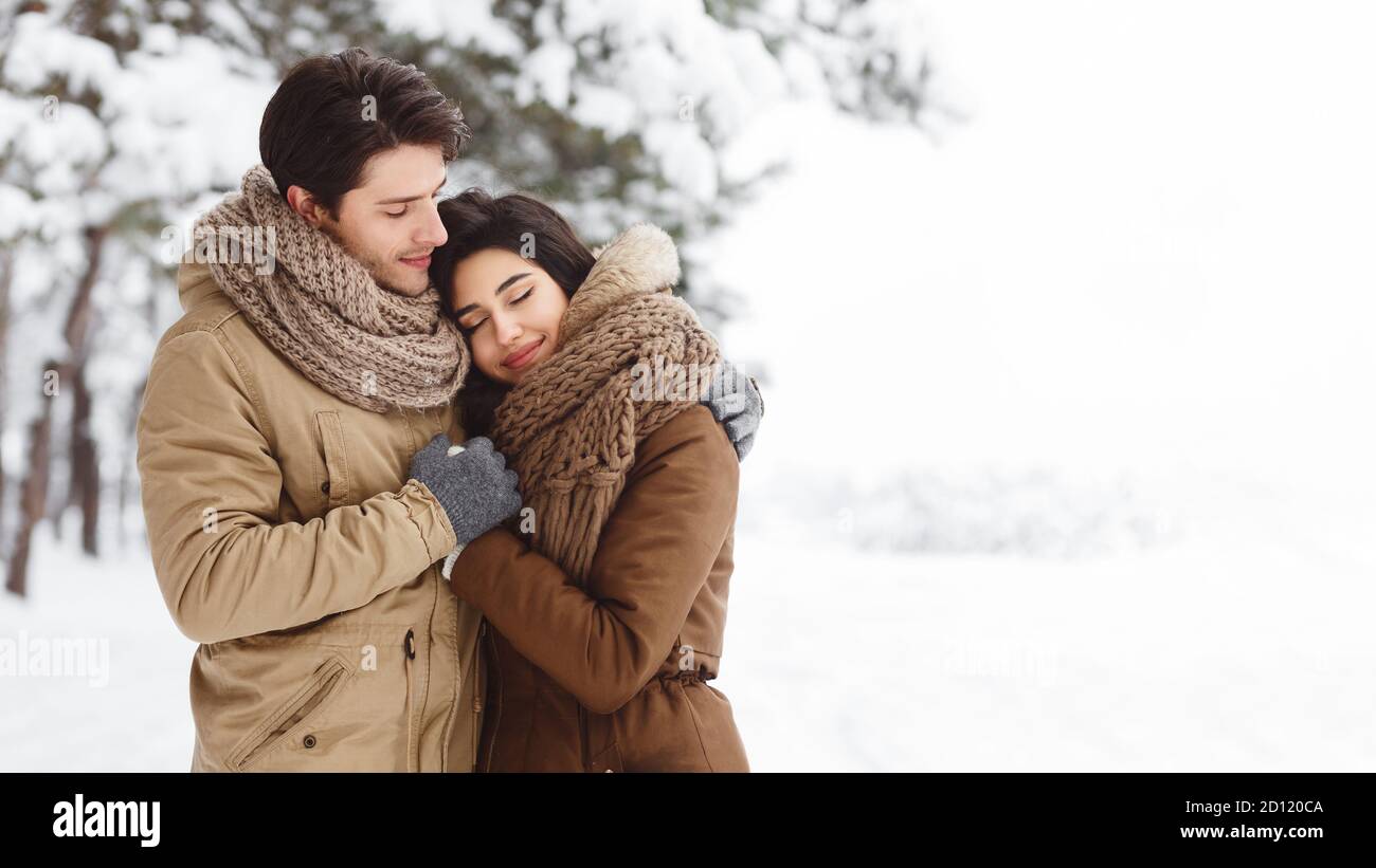 Cute Lovers Embracing Standing In Snowy Forest Outdoor, Panorama Stock ...
