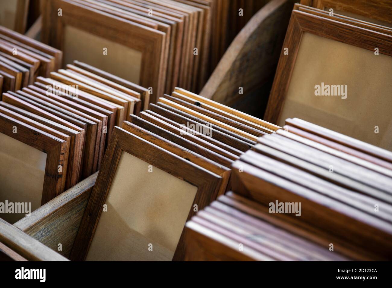 Groups of handmade wooden picture frames organised into groups by size