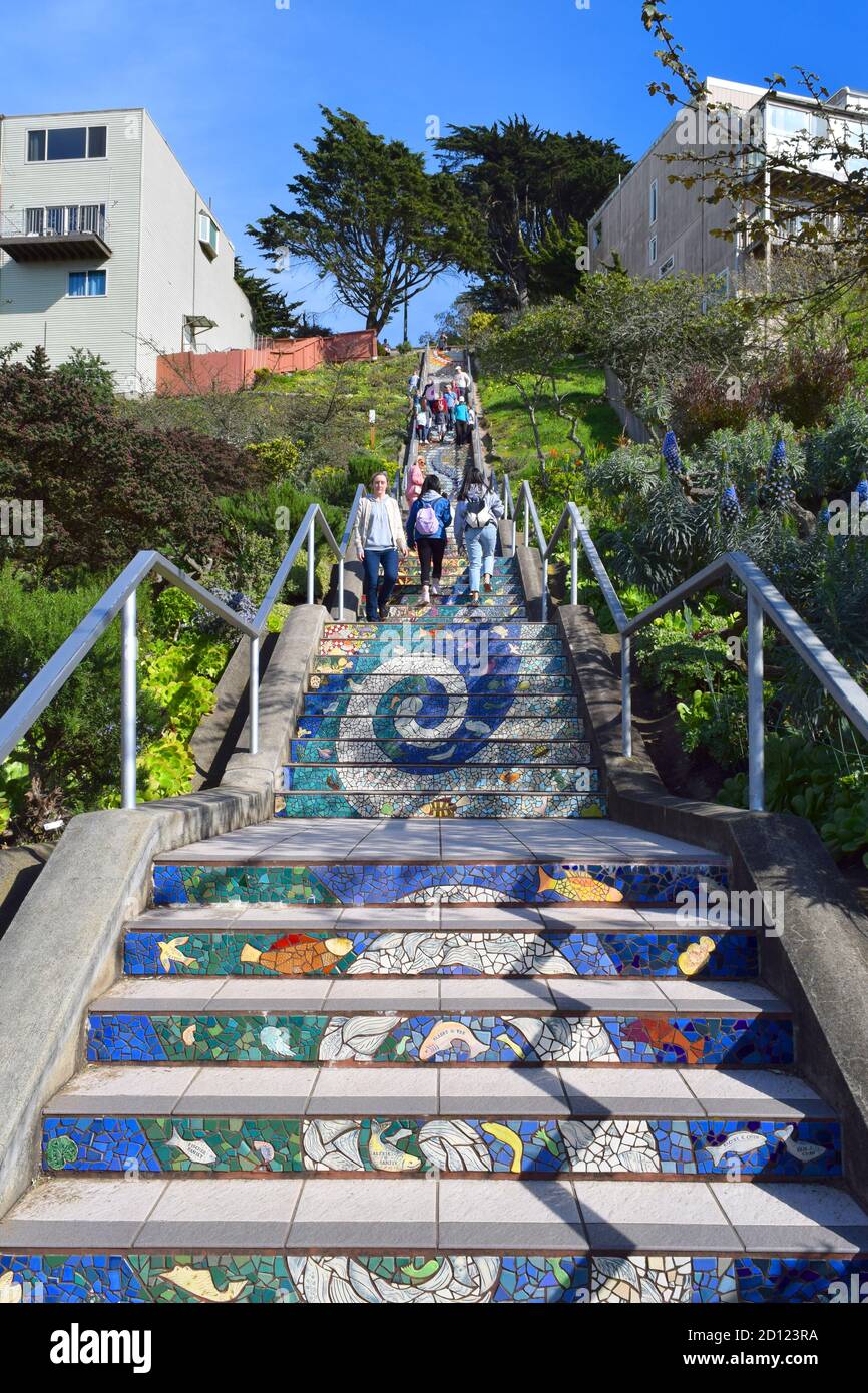 Tourists walk up and down 16th avenue's tiled steps.  San Francisco, CA. Stock Photo