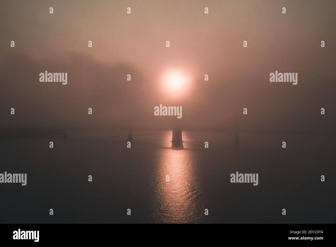 Gloomy apocalyptic sunrise over Bay Bridge in San Francisco Stock Photo