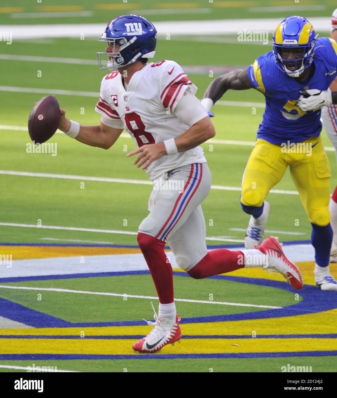 Inglewood, United States. 04th Oct, 2020. New York Giants quarterback Daniel Jones avoids being tackled by the Los Angeles Rams in the second half at SoFi Stadium in Inglewood, California on Sunday, October 4, 2020. The Rams won 17 to 9. Photo by Lori Shepler/UPI Credit: UPI/Alamy Live News Stock Photo