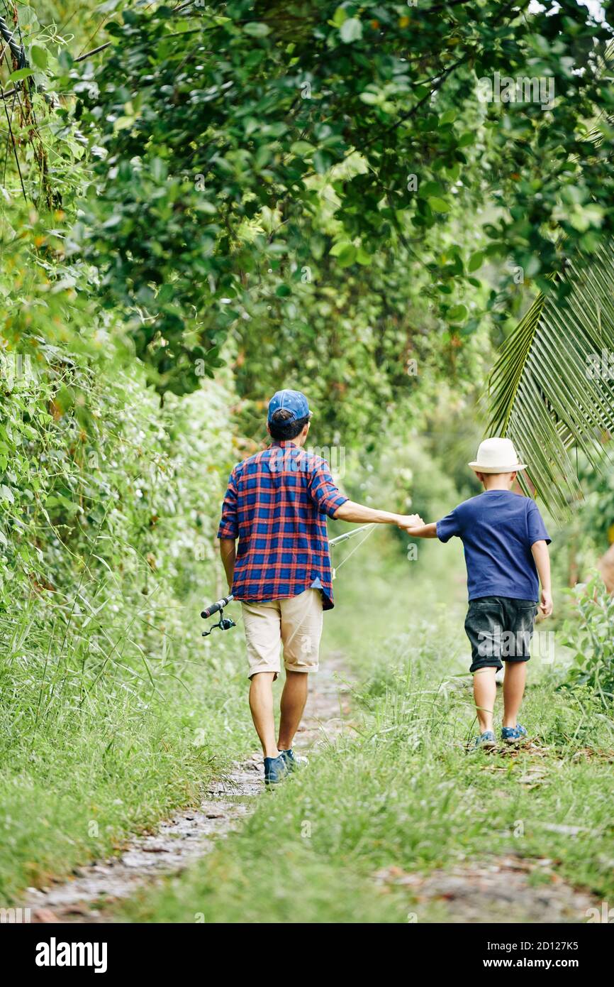 Boy with father going fishing hi-res stock photography and images - Alamy