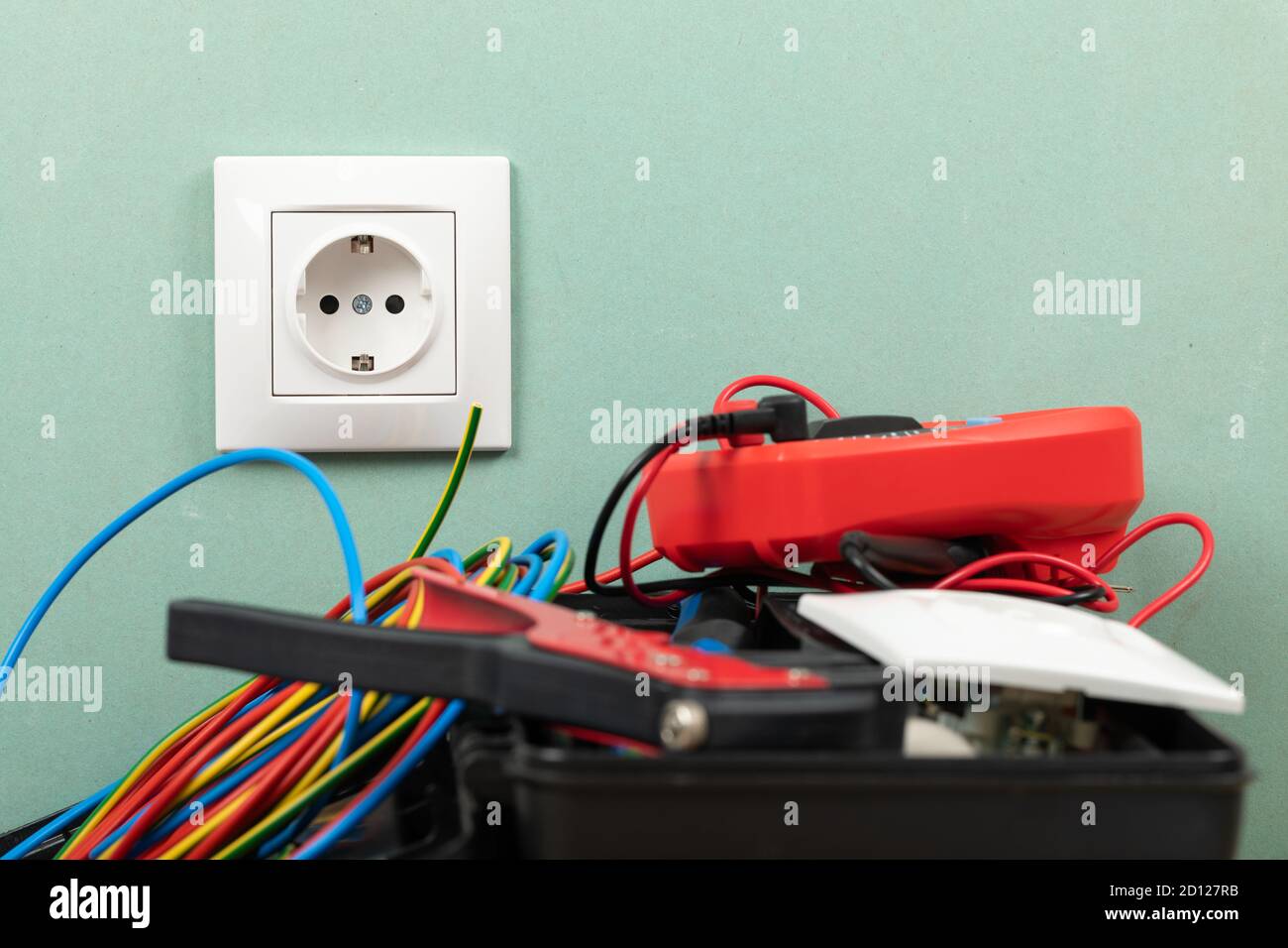 Tools for electrician needs: multimeter, voltage testers, wire strippers, pliers, Stock Photo