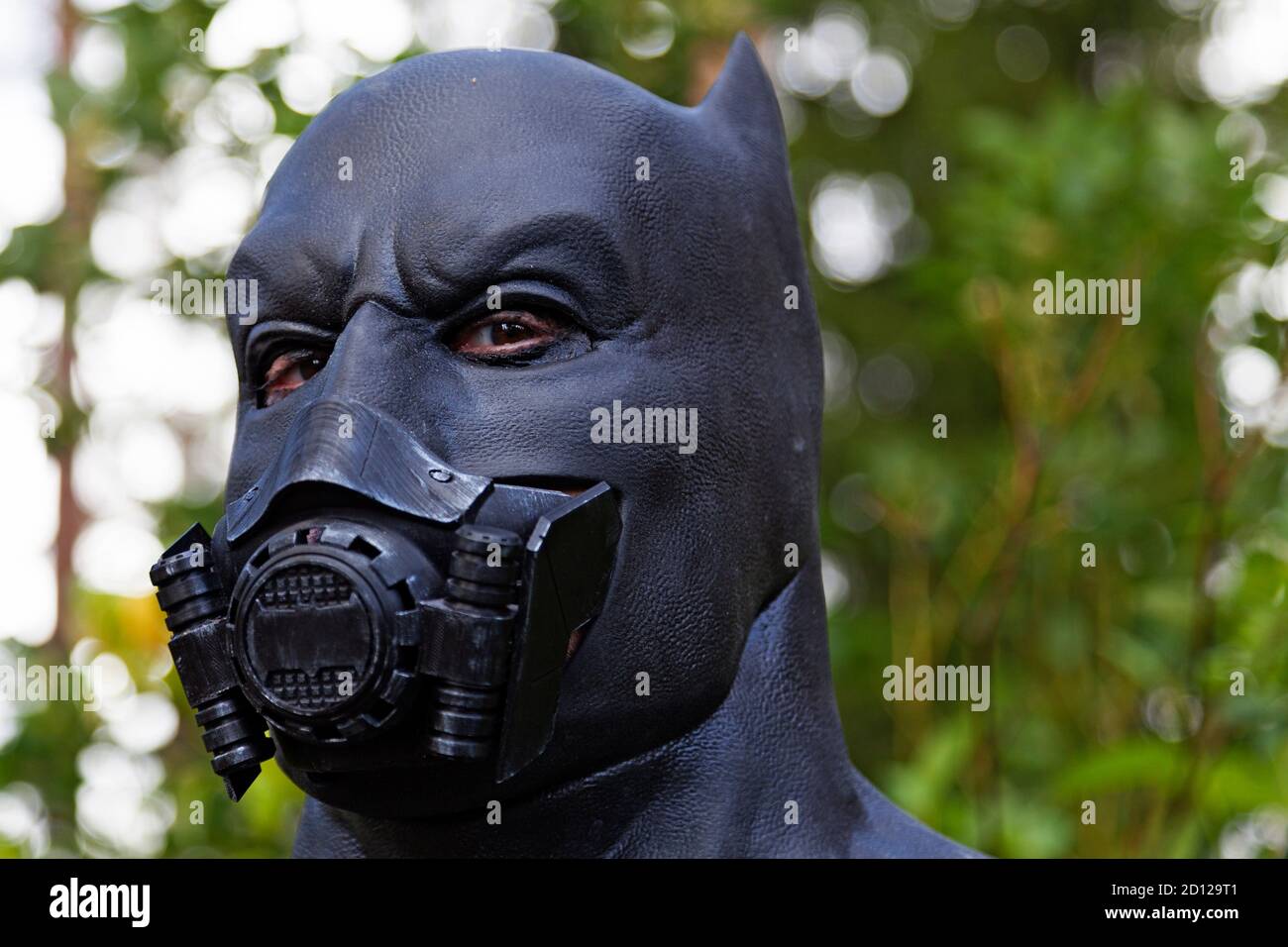 Umea, Norrland Sweden - September 5, 2020: Batman with breathing mask in the forest Stock Photo