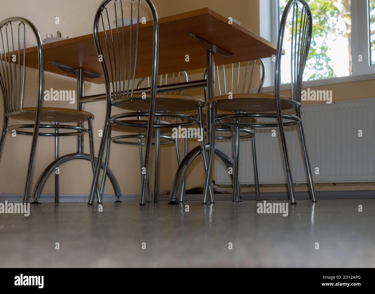 school kitchen canteen, metal table and chair legs, canteen equipment, catering establishment