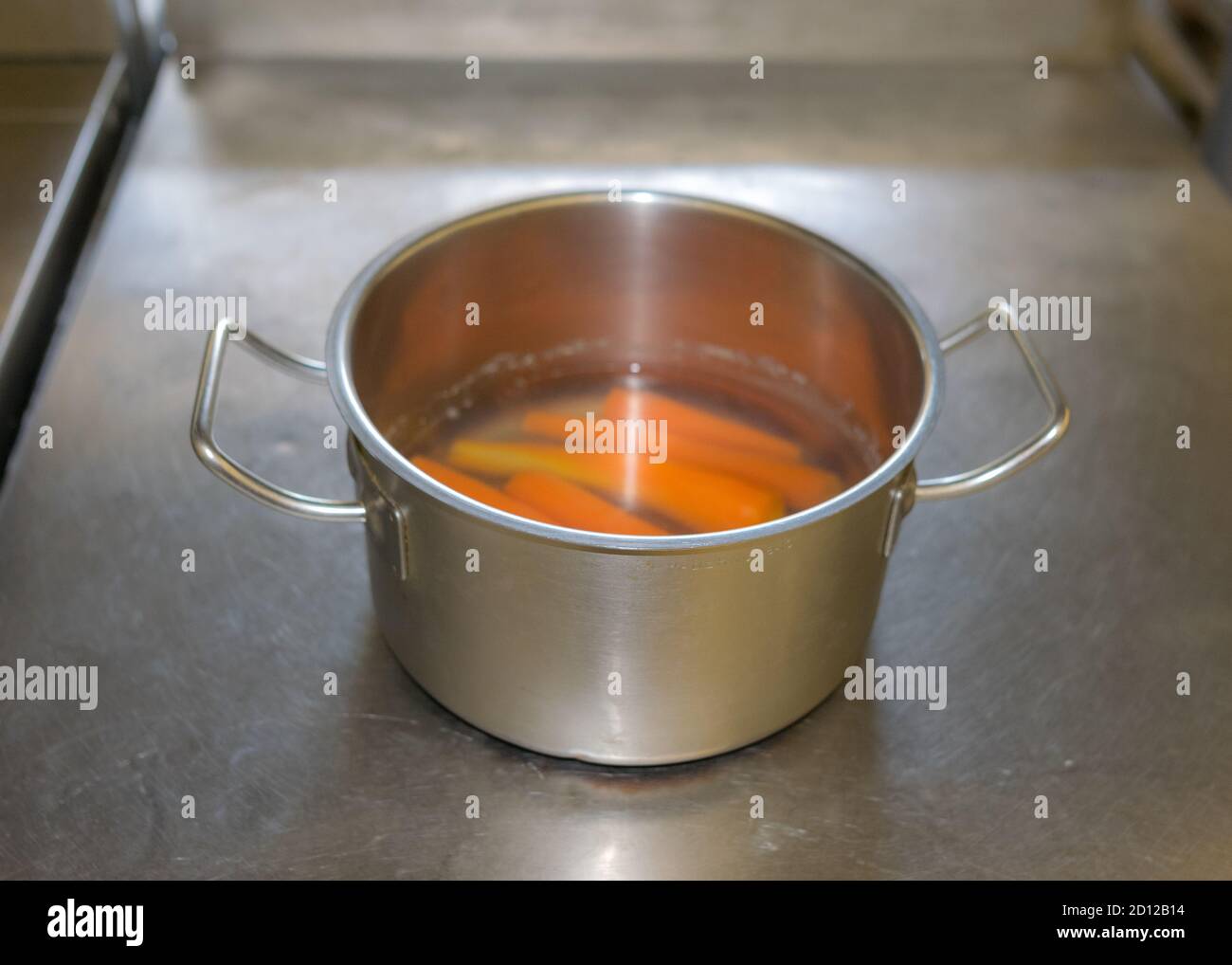 school kitchen canteen, metal pots on the stove surface, canteen