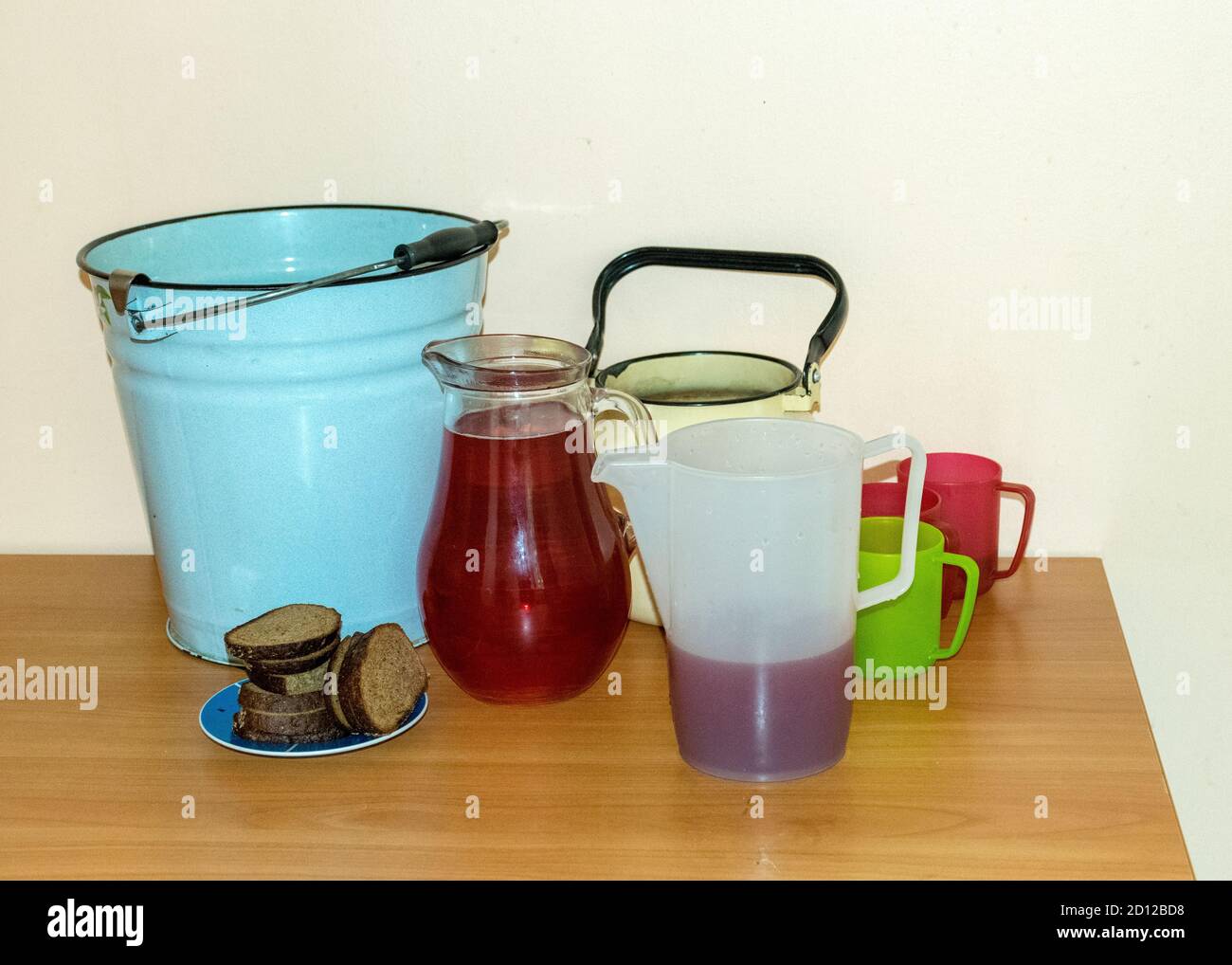 school kitchen canteen, mugs of different shapes and sizes with drinks