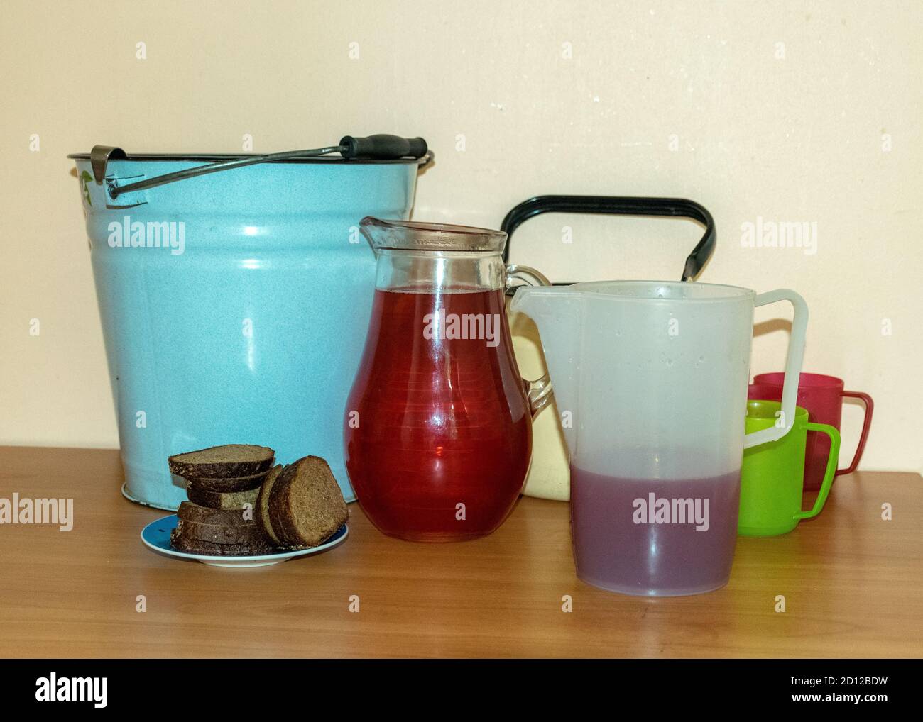 school kitchen canteen, mugs of different shapes and sizes with drinks