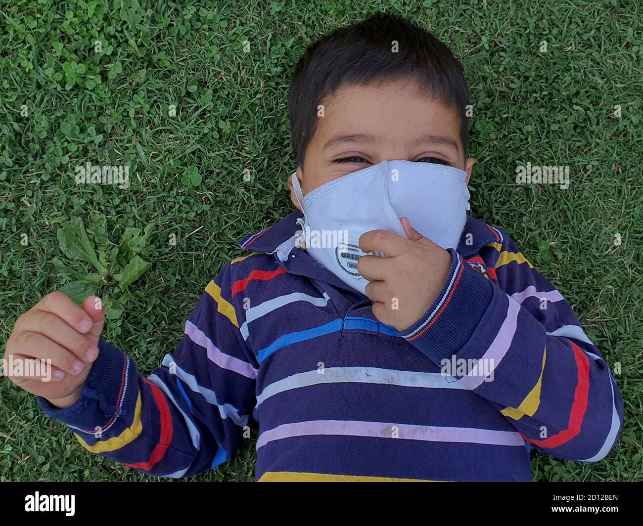 Kids play wearing mask after the coronavirus lockdown in asian
