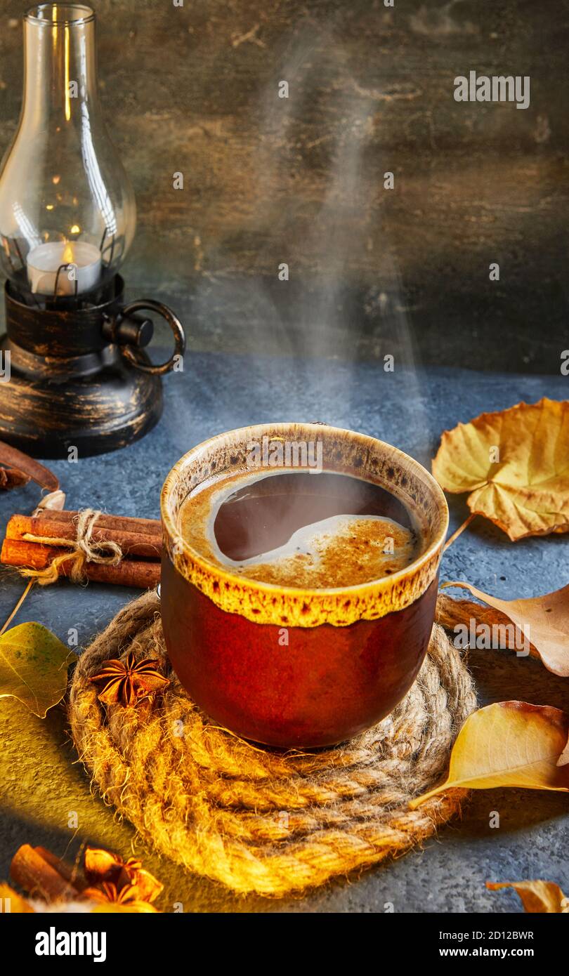 Autumn, fall leaves, a hot steaming cup of coffee and a warm scarf ...