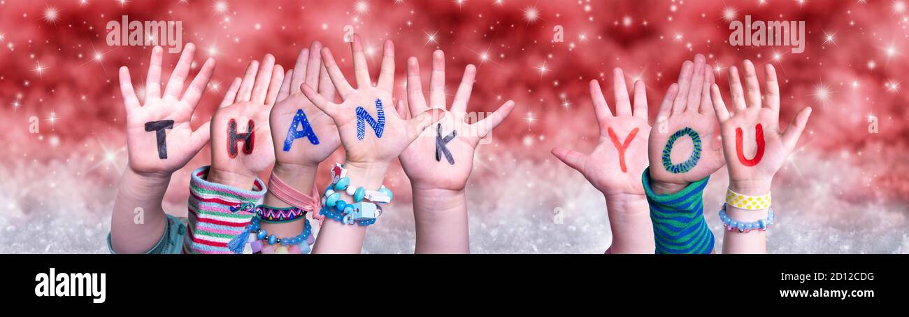 Children Hands Building Word Thank You, Red Christmas Background Stock Photo