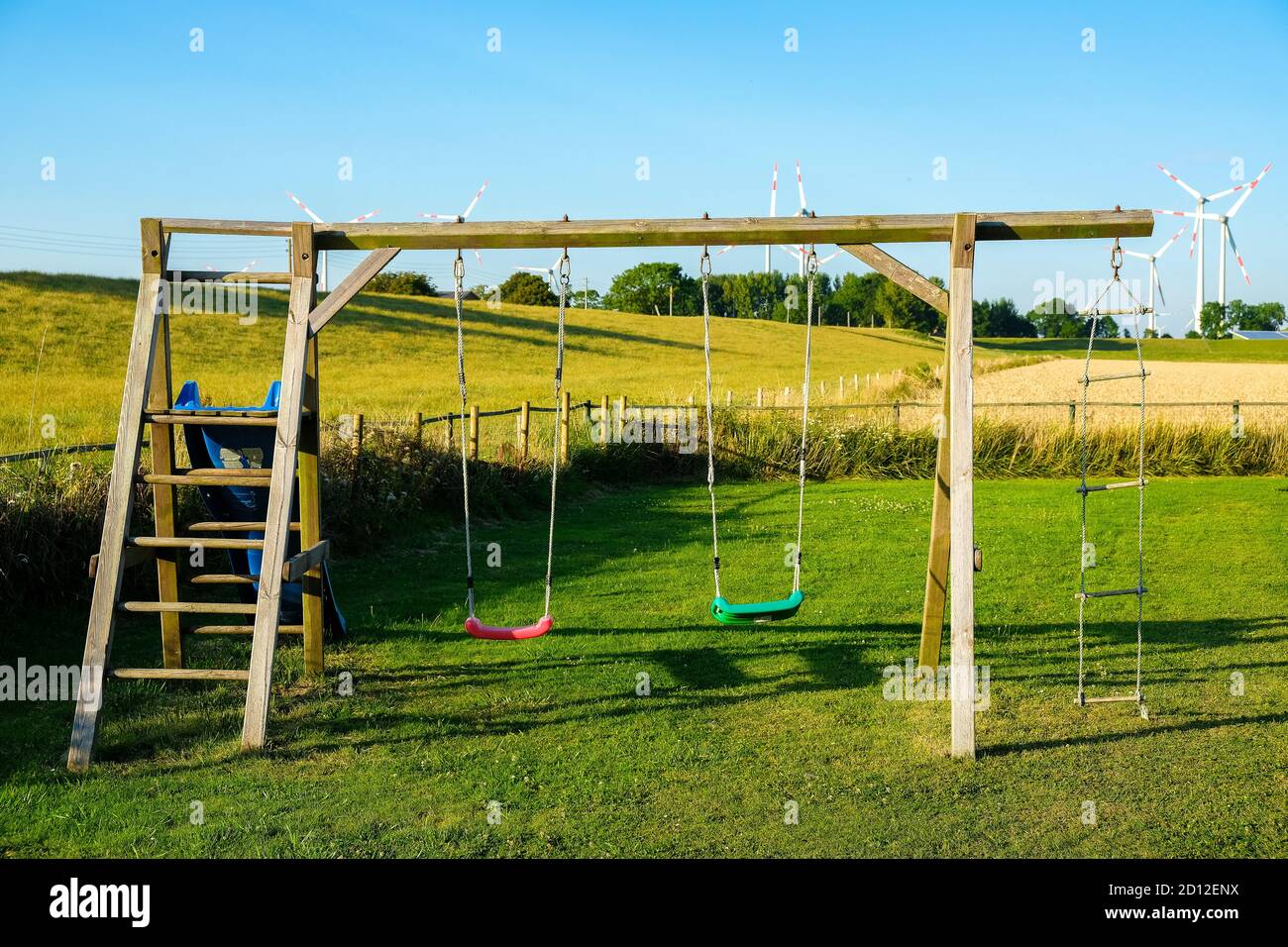 Outdoor playground with swings Stock Photo