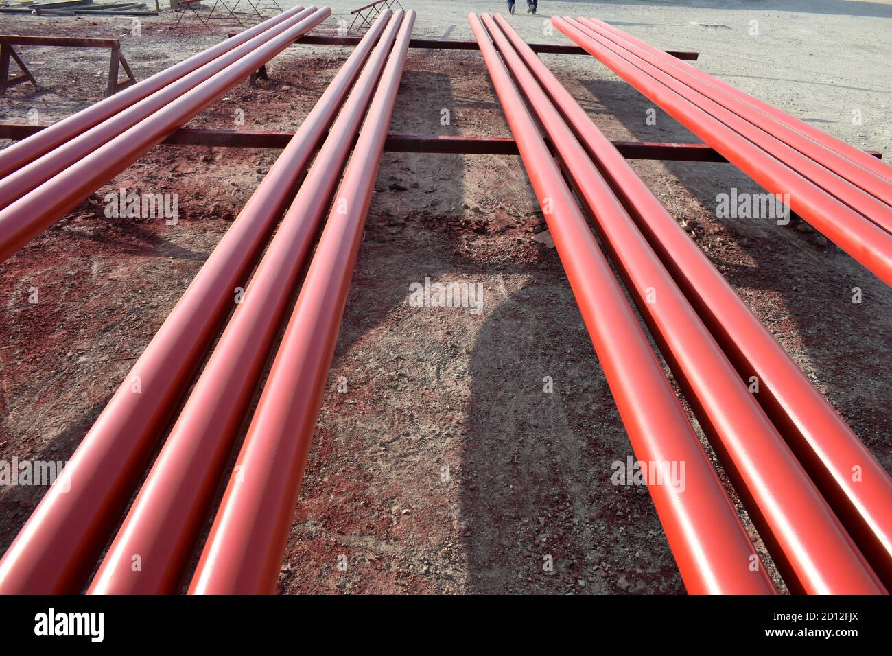 Red steel pipes for fire fighting system and extinguishing water lines in  industrial building. Paint shop. Steel pipe painted red color Stock Photo -  Alamy