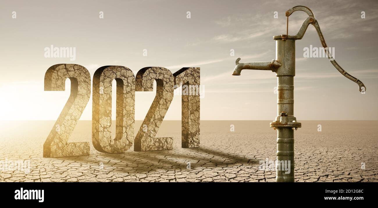 Dry cracked desert with rusty water pump and figures 2021. Drought and water scarcity caused by global warming Stock Photo